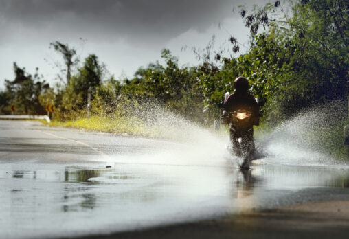 Motorbike riding through a puddle